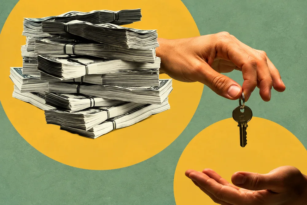 A hand trading a stack of cash for a house key